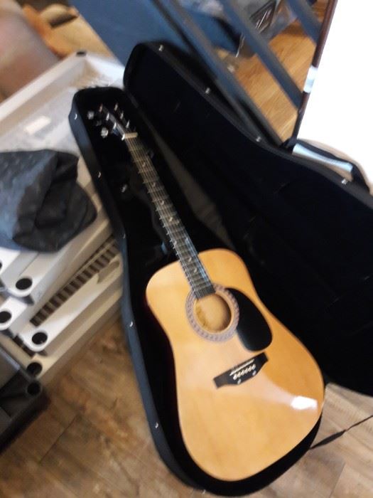 Acoustic guitar in its case