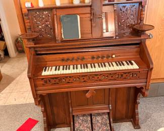 Antique Victorian carved wood pump organ at an Arlington estate sale