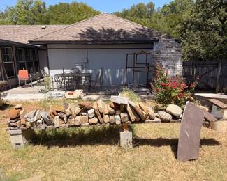 Backyard with stacked landscape stones and patio furniture