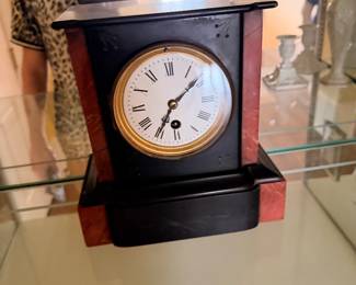 Black marble mantel clock with Roman numeral dial