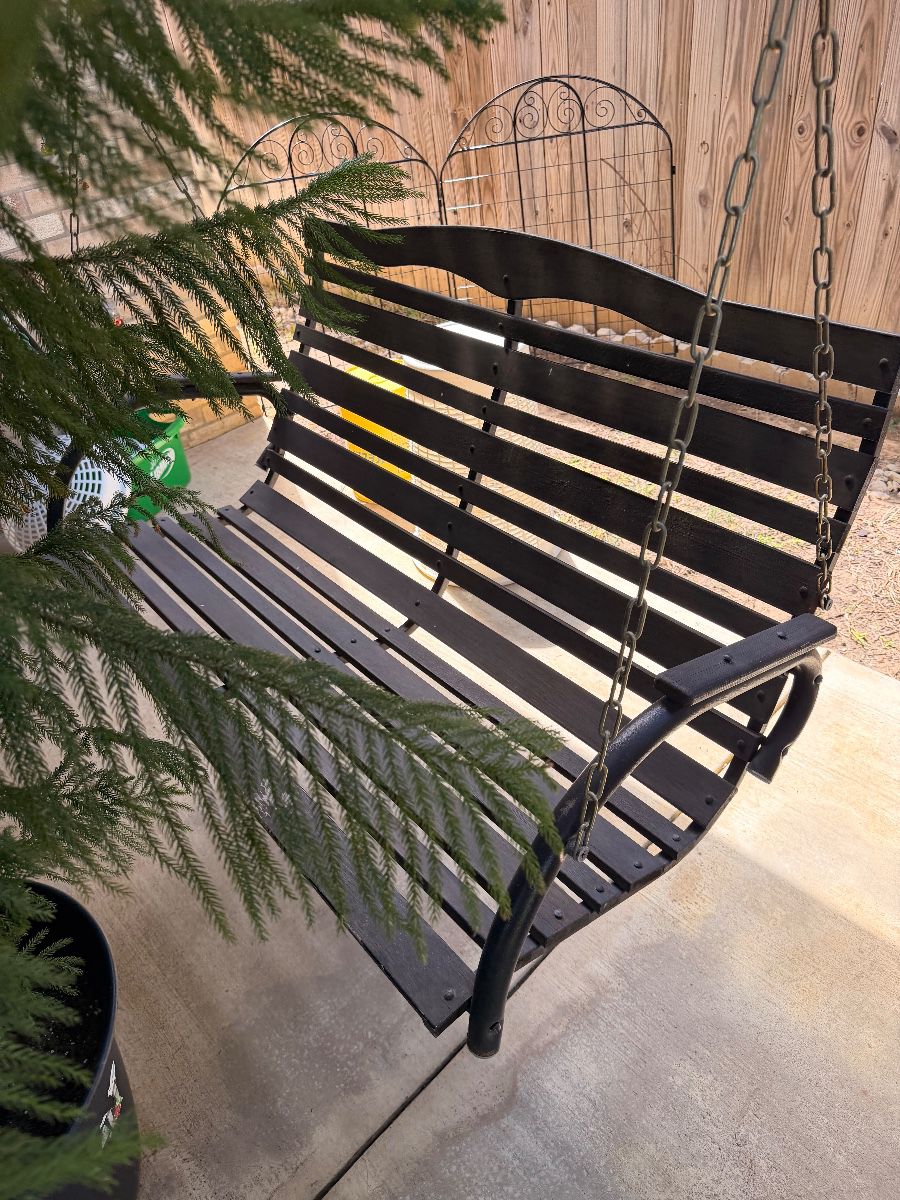 Black metal porch swing