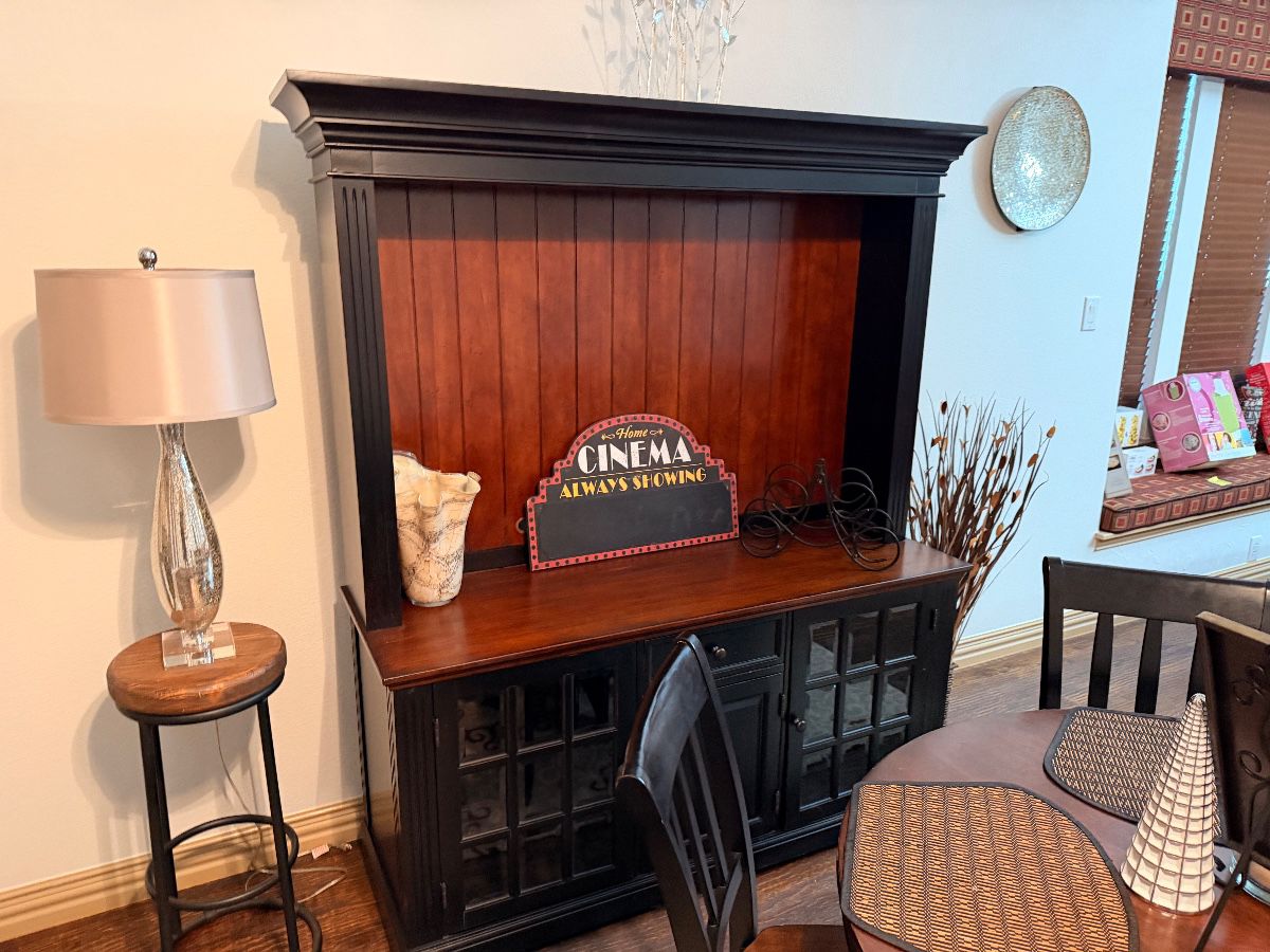 Black wood hutch with lamp and side table