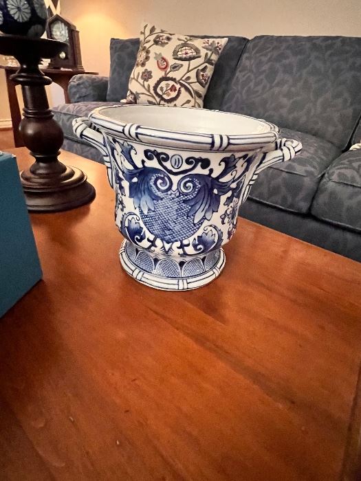 Blue and white ceramic planter on a coffee table