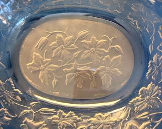Blue pressed glass platter with floral pattern