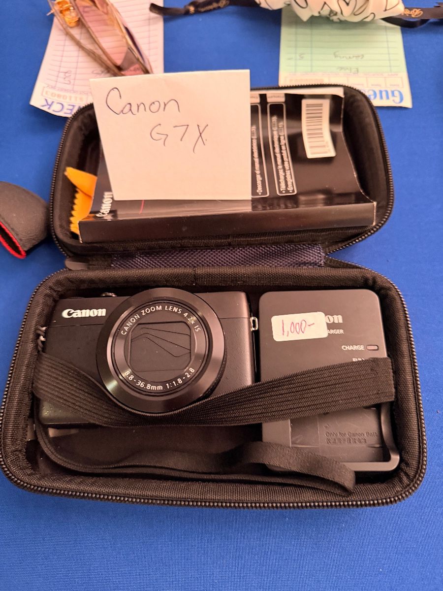 Canon PowerShot G7 X camera in its case