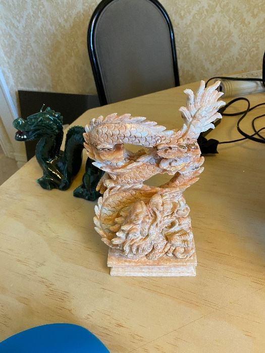 Carved dragon figure and green ceramic dragon