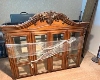 Carved wood lighted china hutch with glass doors