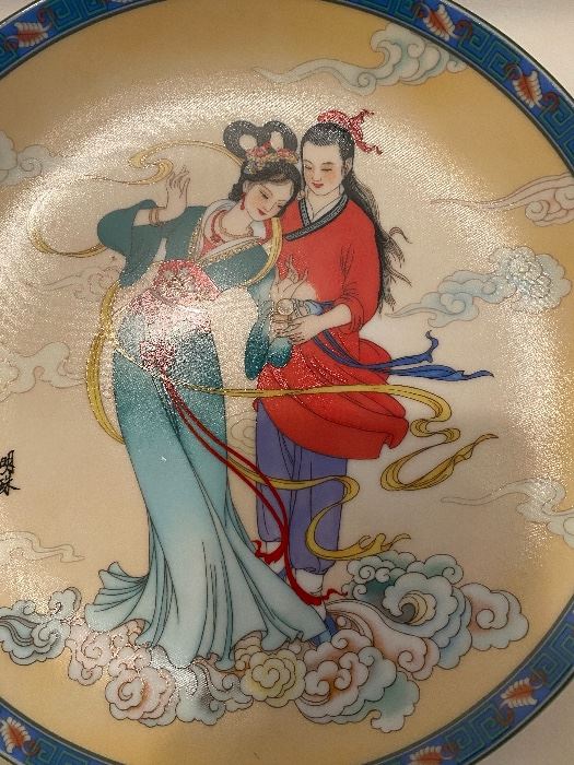 Chinese collector plate of a couple in the clouds