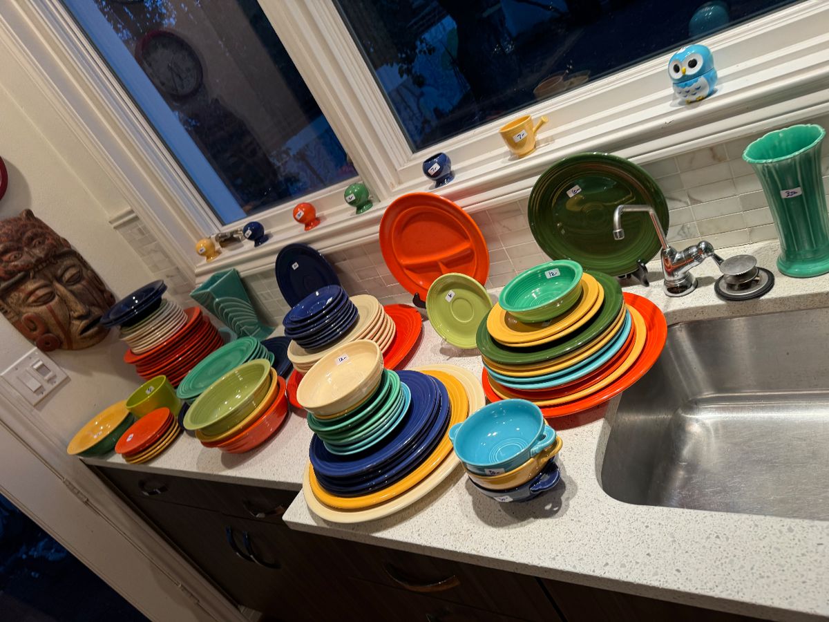 Colorful Fiesta dinnerware stacked on a kitchen counter