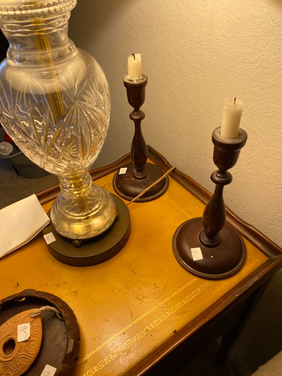 Crystal lamp and wooden candlesticks on a desk