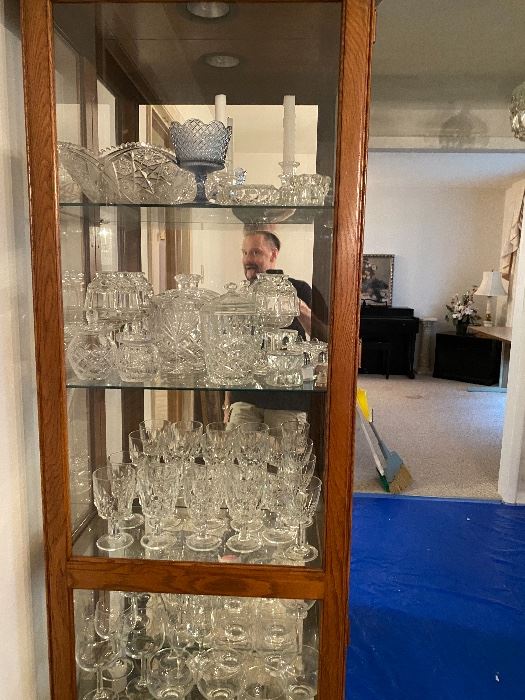 Curio cabinet full of crystal glassware