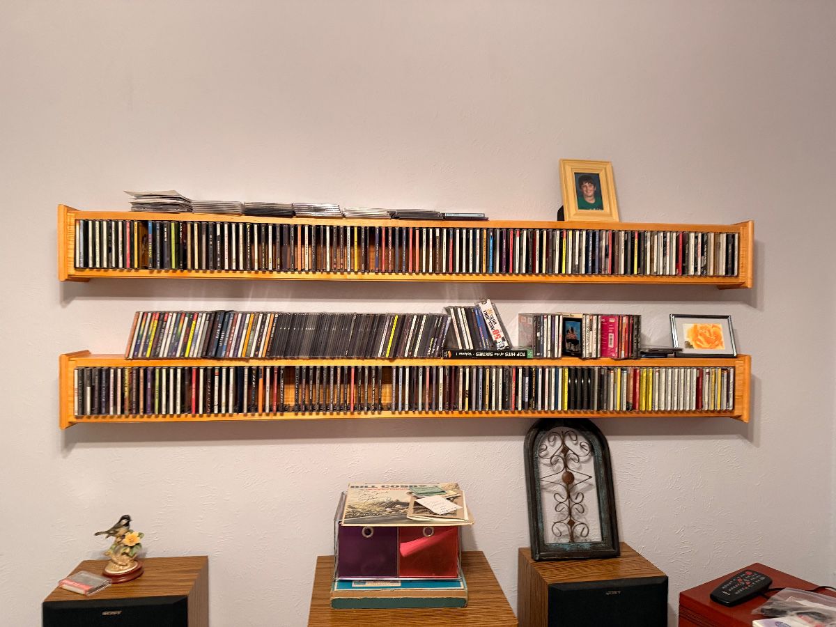 Custom wall shelves full of CDs