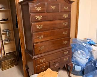 Dark wood traditional highboy chest of drawers from a bedroom set