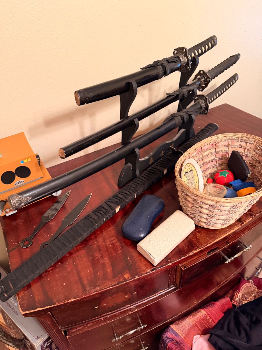 Display of decorative swords on a stand