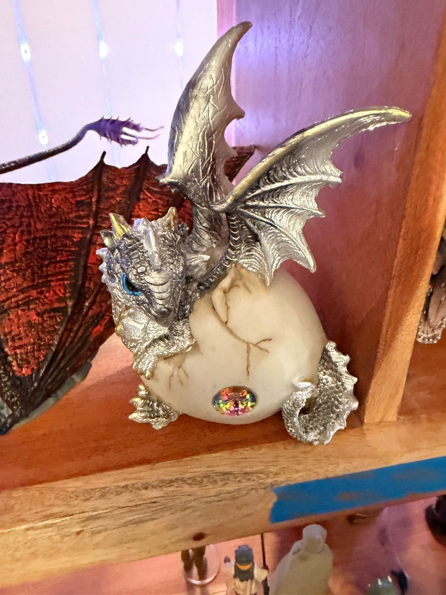 Dragon hatching from an egg statue