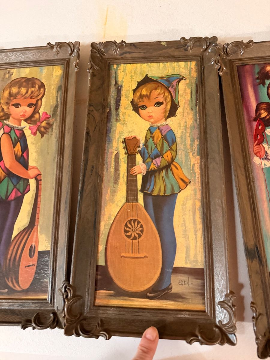 Framed big-eye girl art prints in carved frames