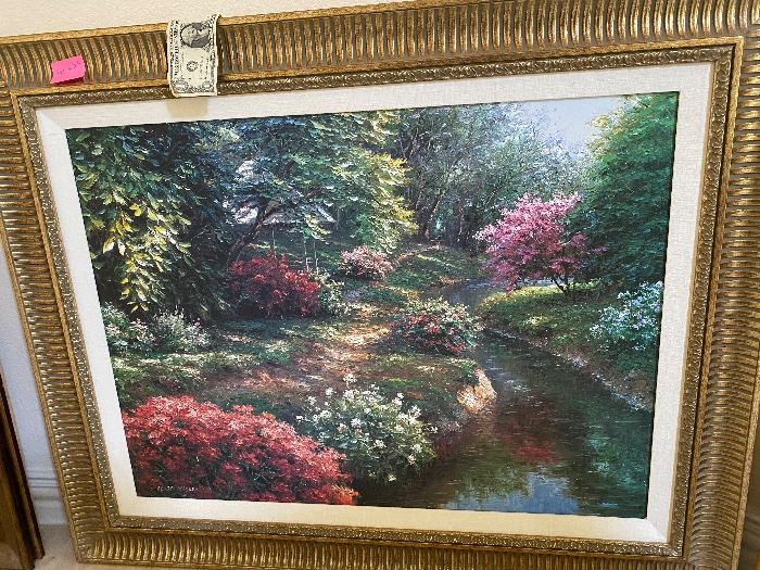 Framed garden landscape painting in a gold frame
