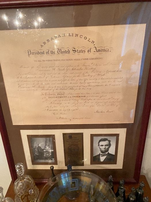 Framed presidential document bearing Abraham Lincoln's name with portraits