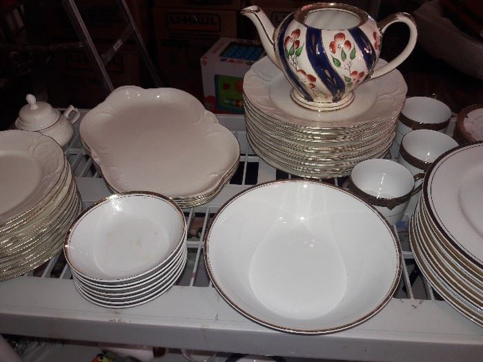Gold rimmed china and a painted teapot