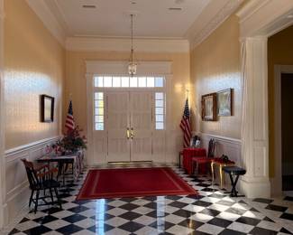 Grand foyer with checkerboard marble floor at the Arlington mansion estate sale