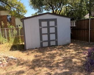Gray outdoor storage shed with double doors