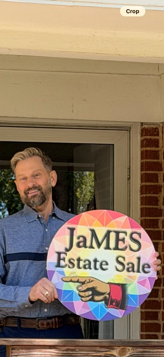 James Major holding a James Major Estate Sales sign at the Arlington estate sale