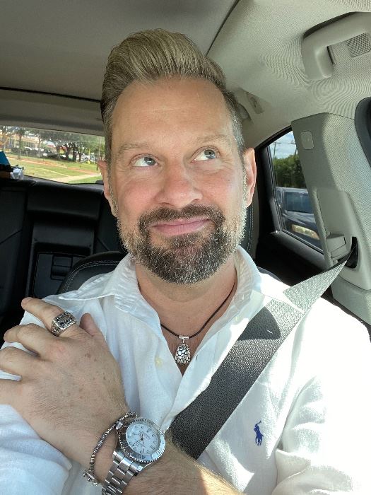 James Major of James Major Estate Sales smiling in his car