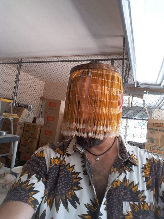 James Major of James Major Estate Sales wearing a beaded lampshade as a hat