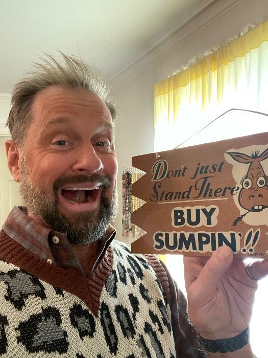 James Major of James Major Estate Sales with a Buy Sumpin sign
