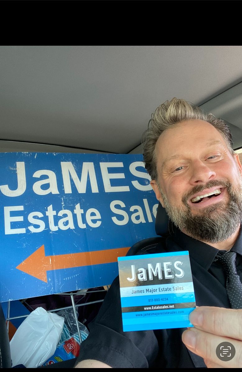 James Major of James Major Estate Sales with his sale sign