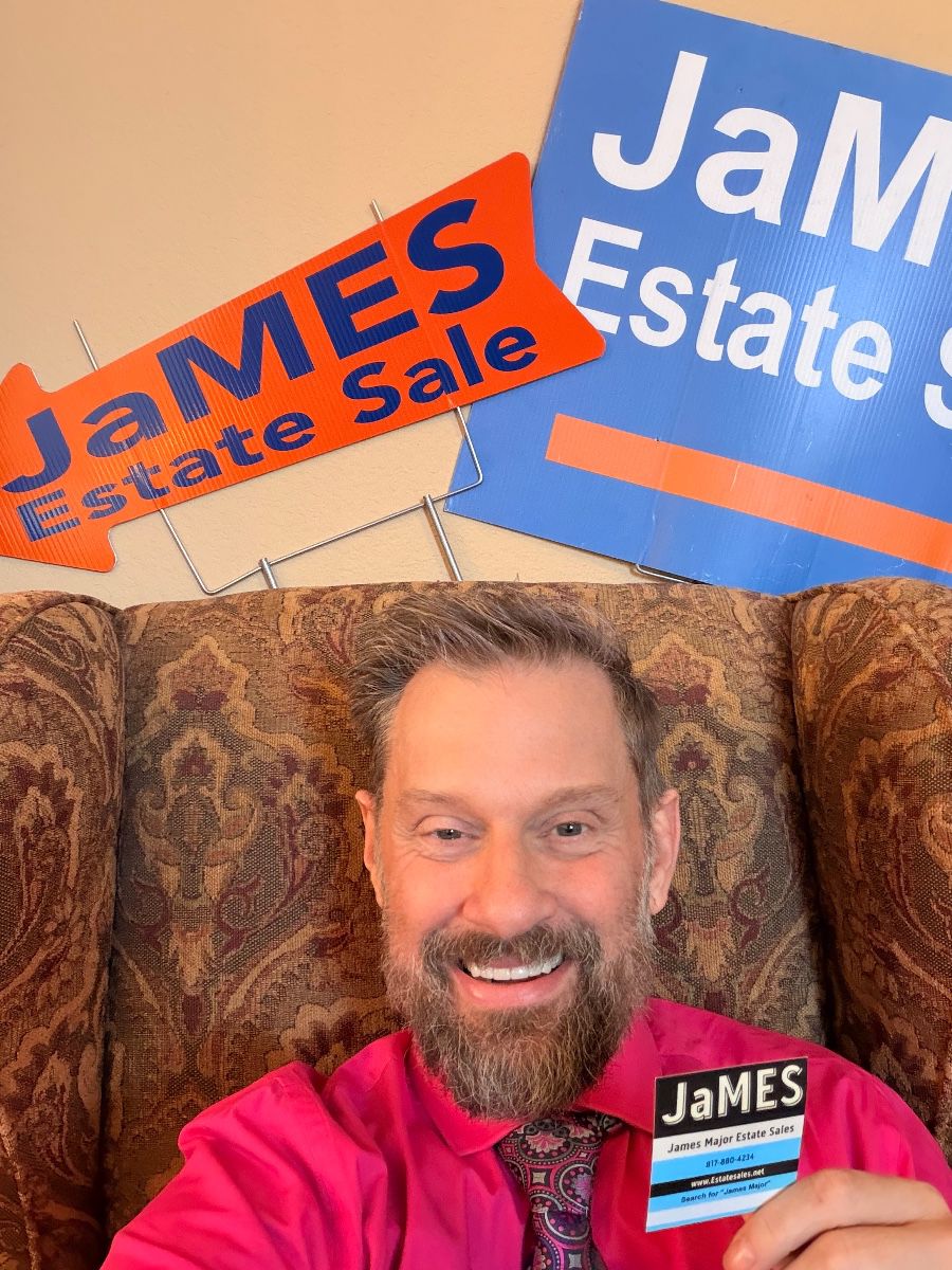 James Major of James Major Estate Sales with his sale signs