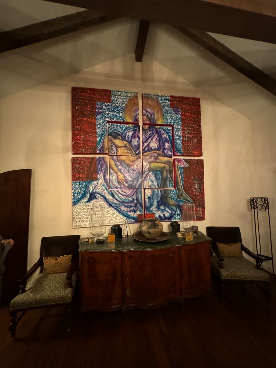 Large multi-panel modern painting above a carved sideboard