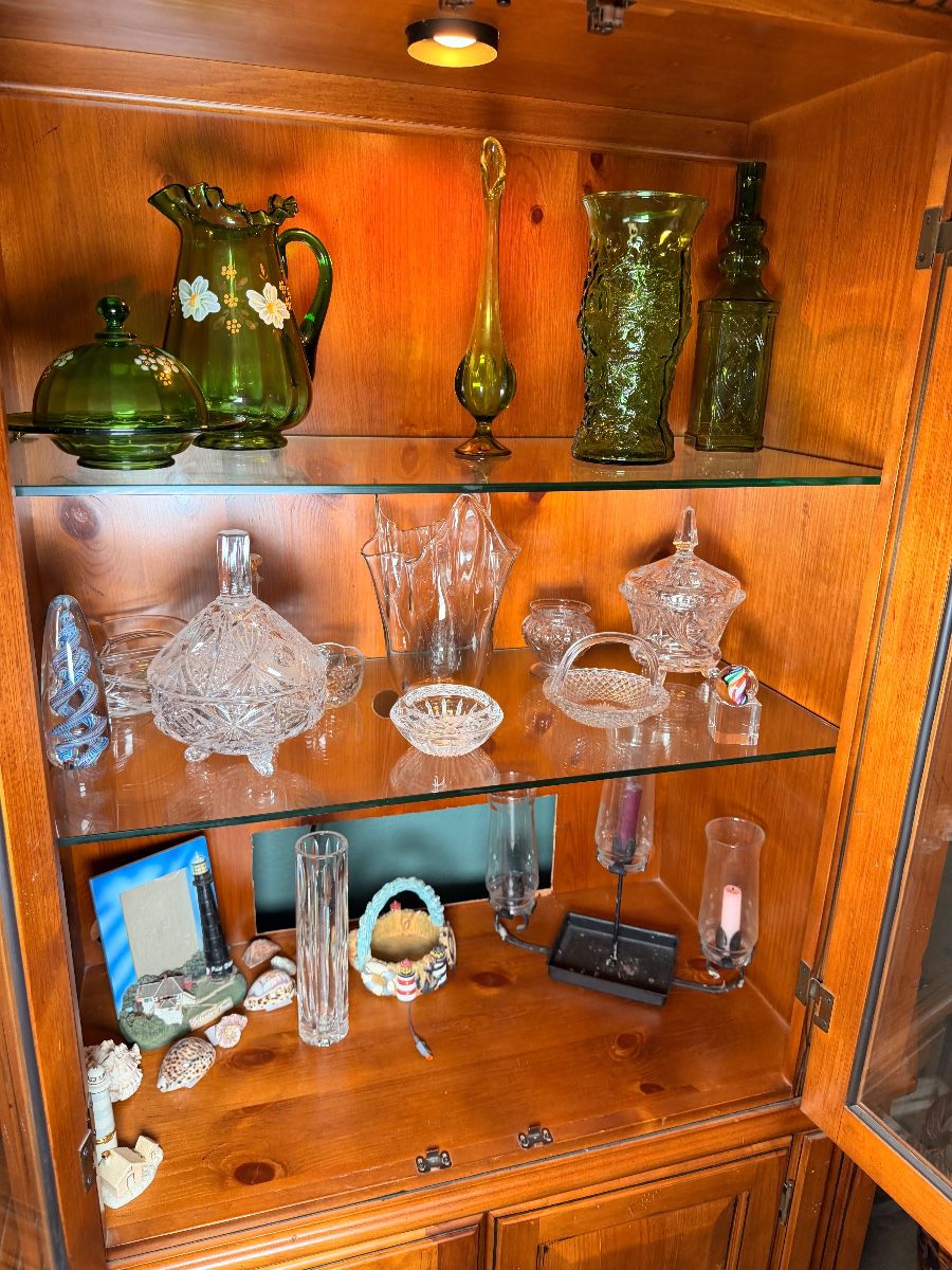 Lighted china cabinet with green glass and crystal