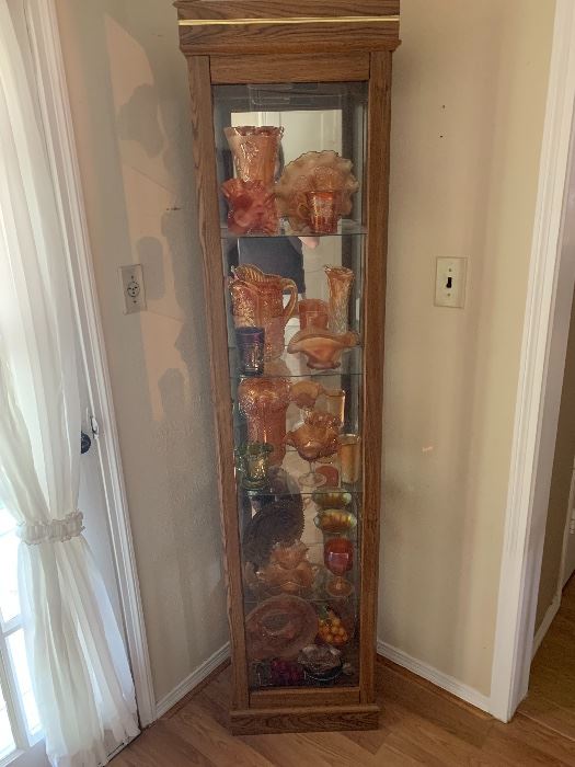 Lighted curio cabinet with amber glass