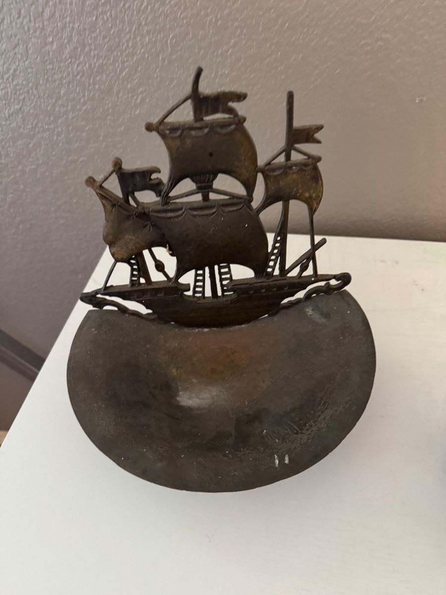 Metal sailing ship sculpture
