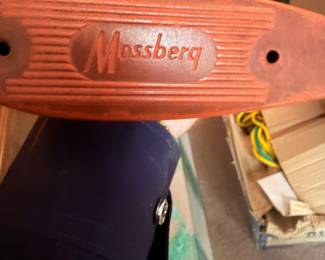 Mossberg logo on a vintage rifle stock