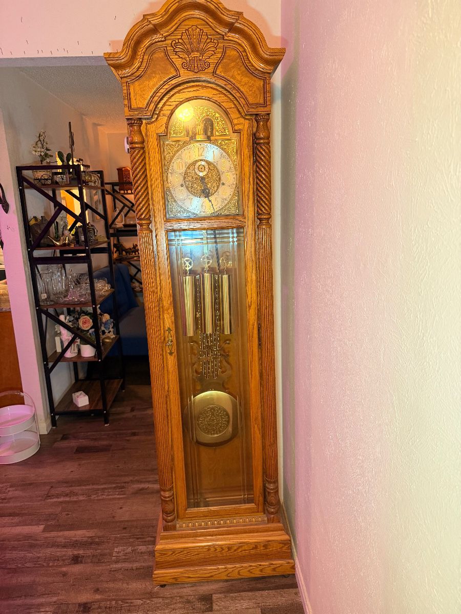 Oak grandfather clock at an Arlington estate sale