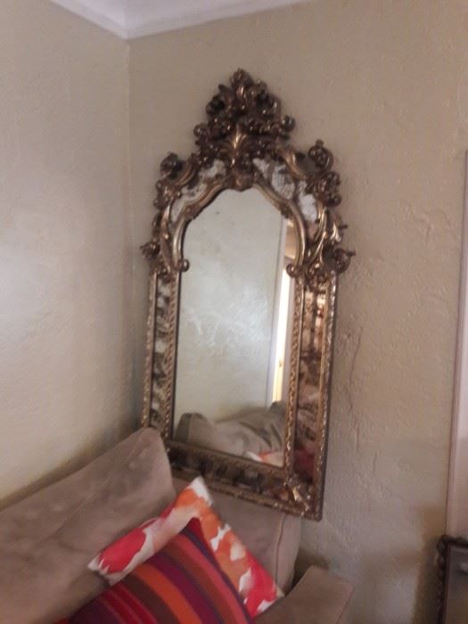 Ornate silver framed wall mirror