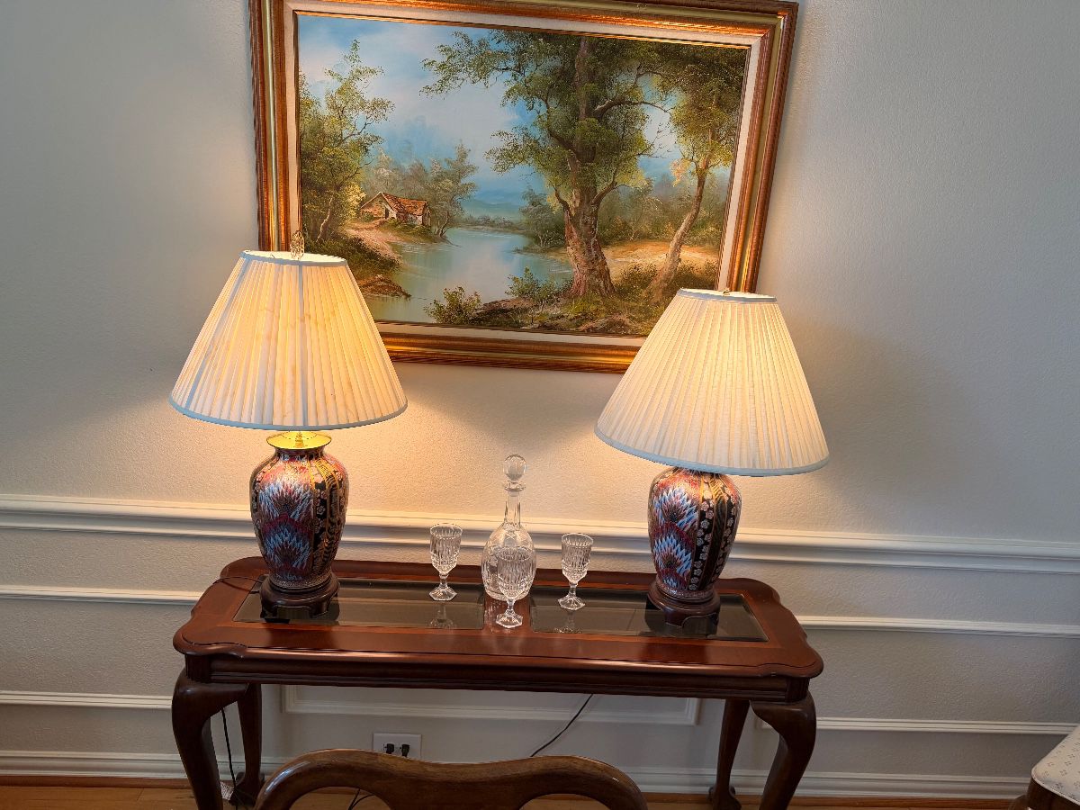 Pair of Asian porcelain lamps on a wood console table