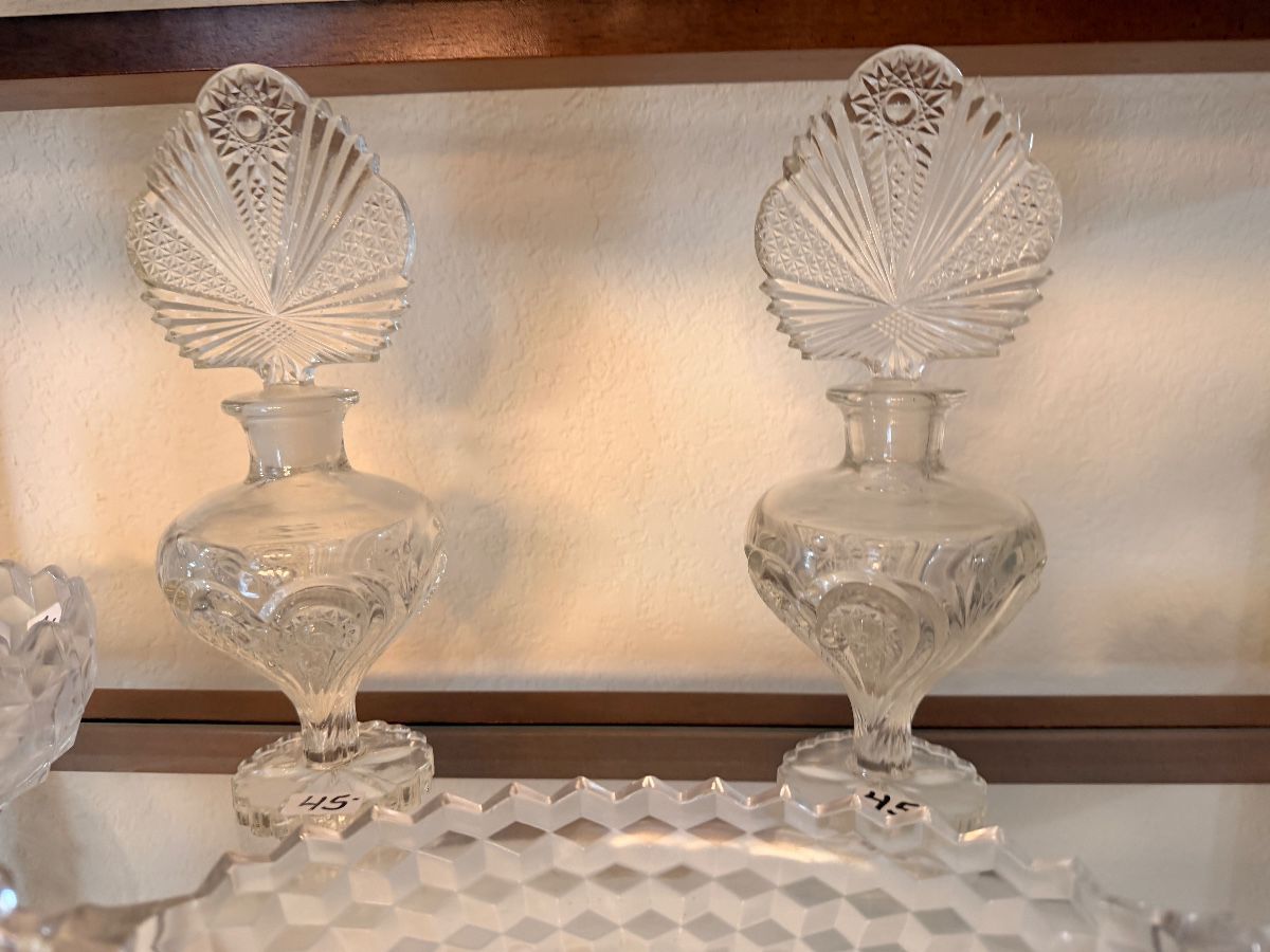 Pair of clear crystal decorative bottles