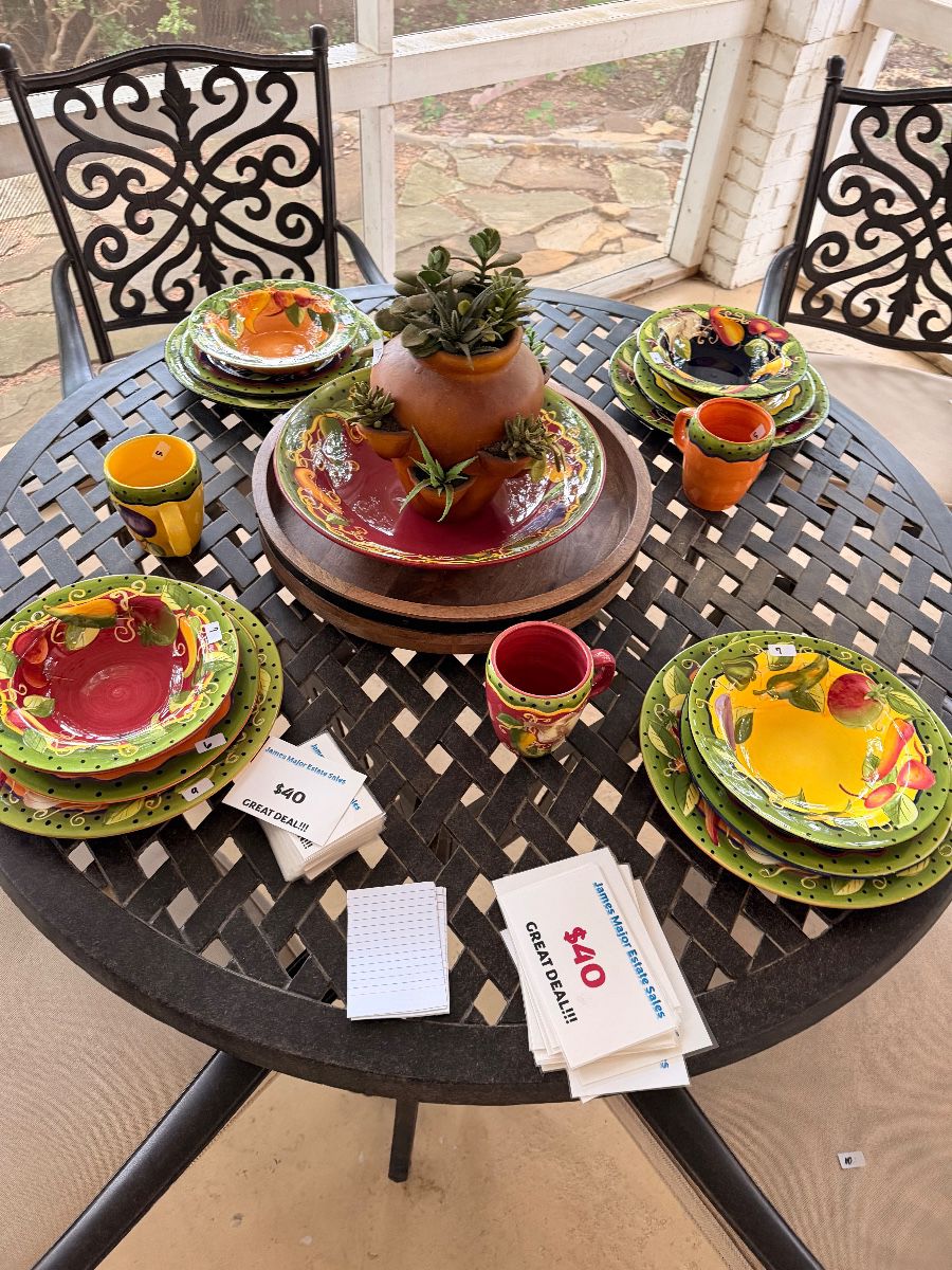 Patio dining table set with colorful hand painted dishes