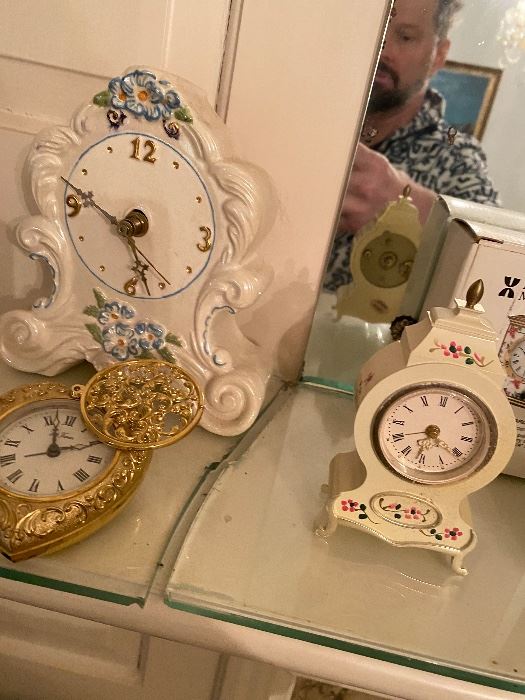 Porcelain mantel clocks with painted flowers