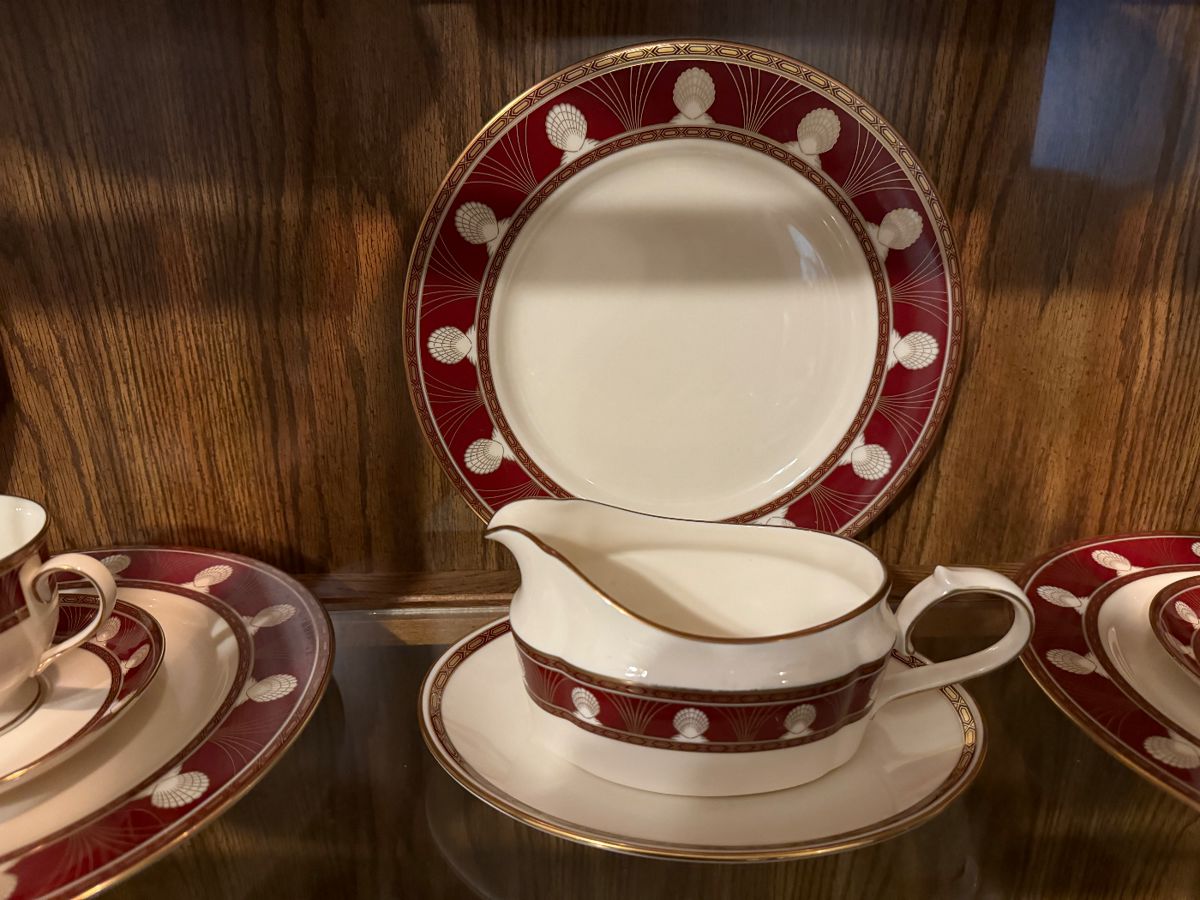 Red and gold banded china with gravy boat