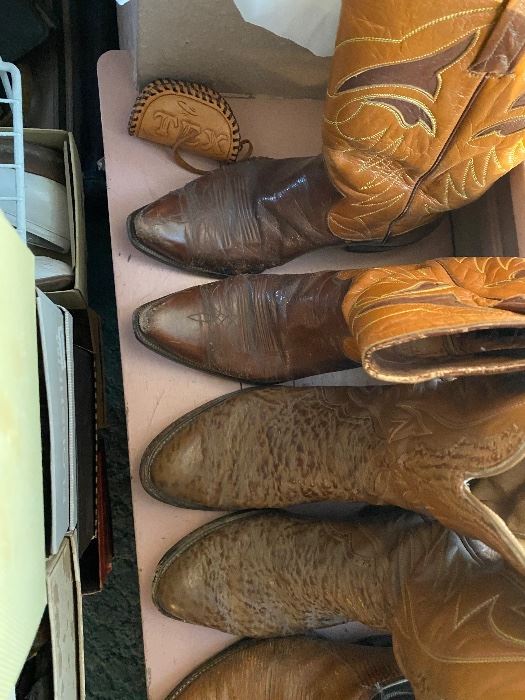 Row of vintage leather cowboy boots