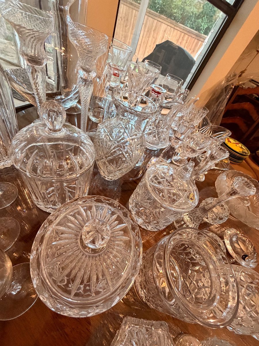 Table of cut crystal glassware and serving pieces