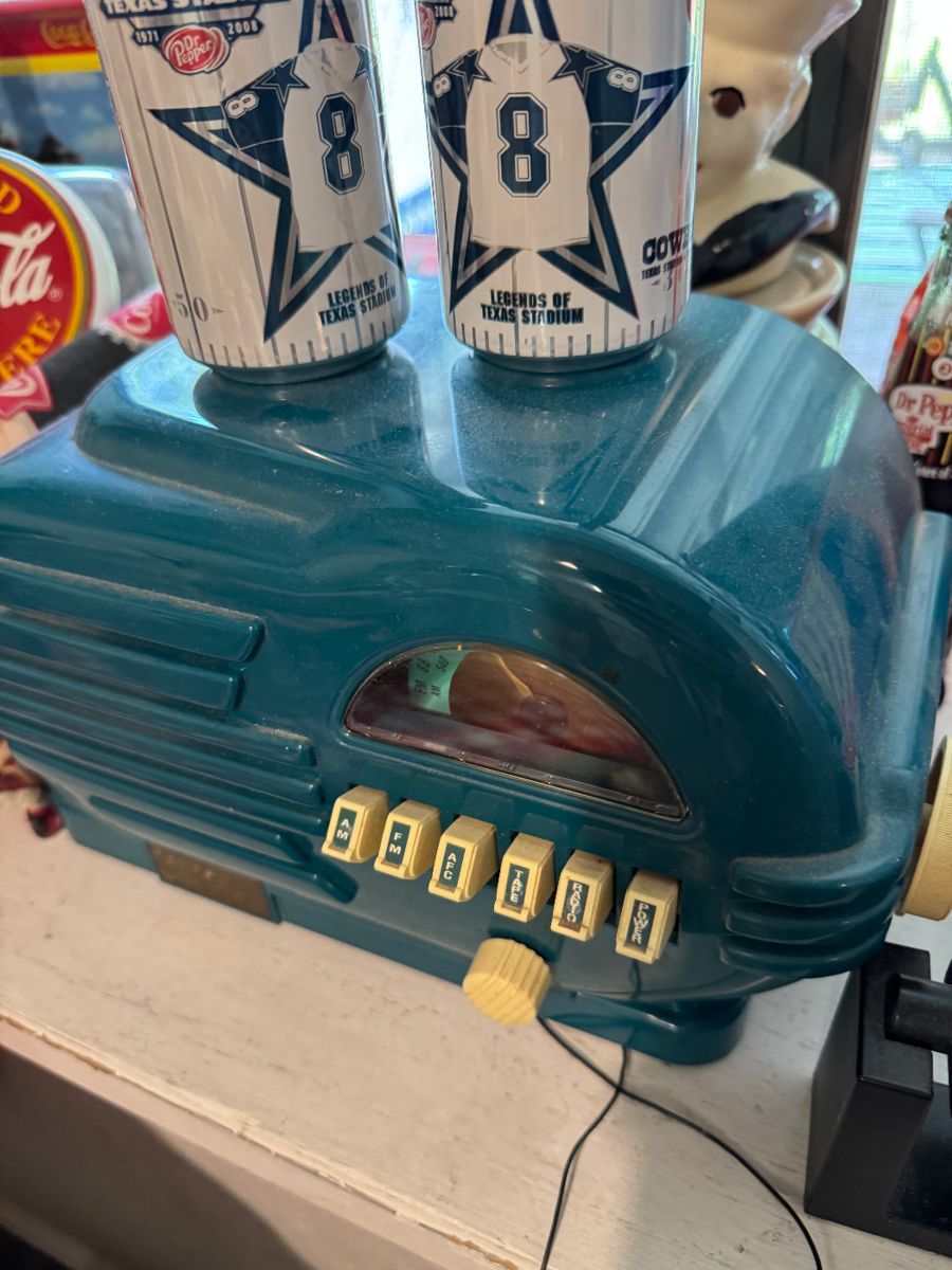 Teal vintage radio with Dallas Cowboys cups