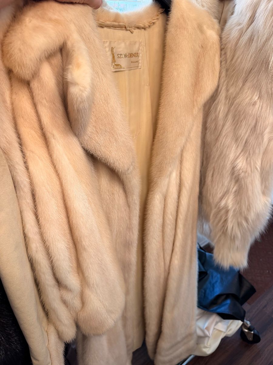 Vintage fur coats at an east Fort Worth estate sale