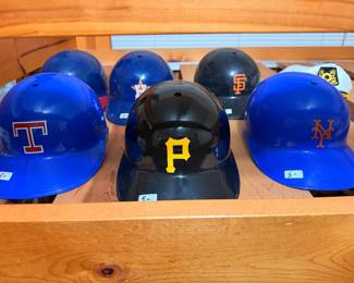 Vintage MLB batting helmets including Pirates, Mets and Rangers