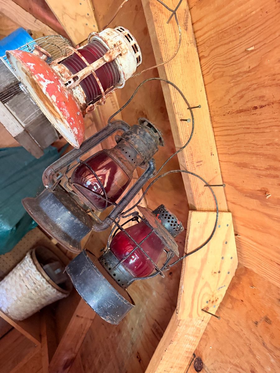 Vintage railroad lanterns with red globes