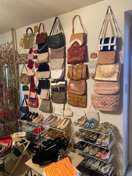 Wall of vintage handbags with shelves of shoes
